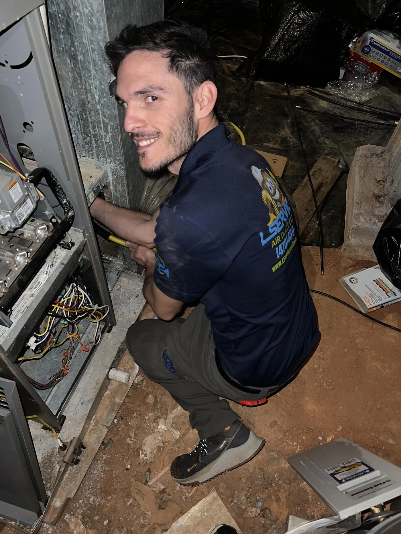 Air duct cleaning by LServices technician